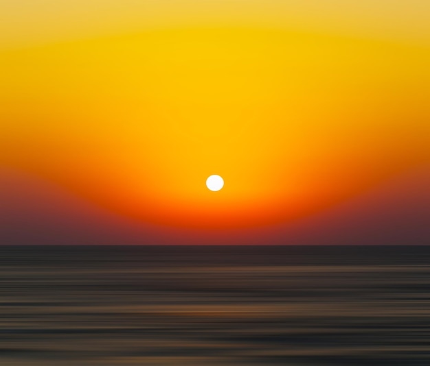 Horizontal naranja vivo atardecer océano horizonte abstracción desenfoque de fondo telón de fondo