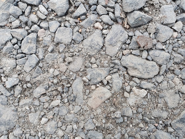 Foto horizontaler asphalthintergrund mit steinen