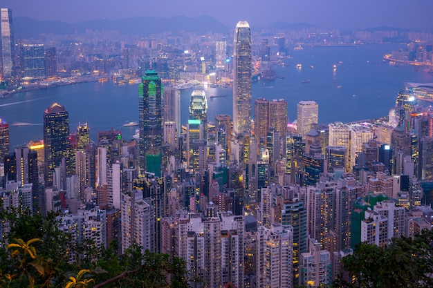 Horizonte de la ciudad de Hong Kong día a noche