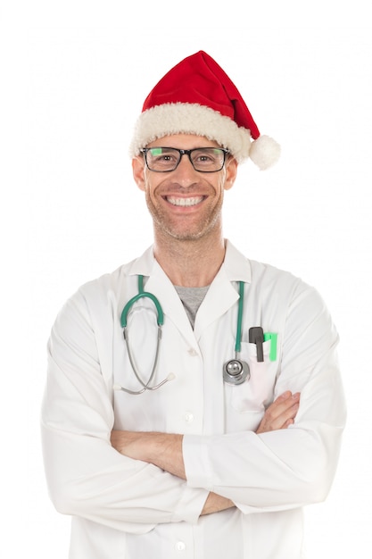 Hübscher Doktor mit dem Weihnachtshut, der einen Weihnachtshut trägt