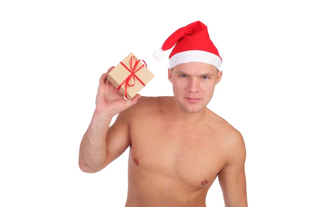 Hübscher junger Mann mit Weihnachtsmann-Mütze, isoliert auf weiß