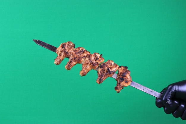 Hühnerfleisch-Aufsteckspindel Stockfotos Chroma-Key-Green-Screen-Hintergrund