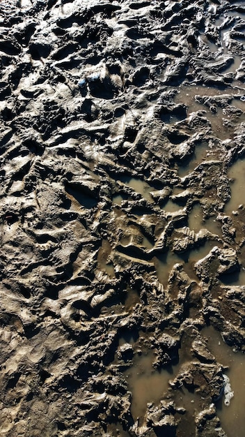 Foto huella o huella de zapato en el barro