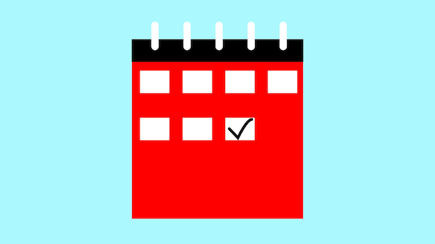 Foto Ícone de calendário vermelho com uma marca de verificação sobre um fundo azul claro