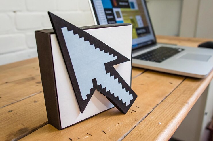 Foto icono de flecha flecha de un icono de computadora hecho en papercraft