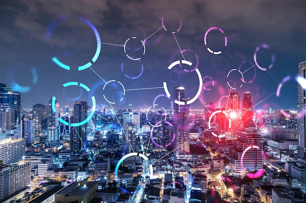 Iconos de tecnología abstracta paisaje urbano panorámico aéreo nocturno de Bangkok Asia El concepto de enfoque innovador para optimizar el proceso comercial internacional Doble exposición