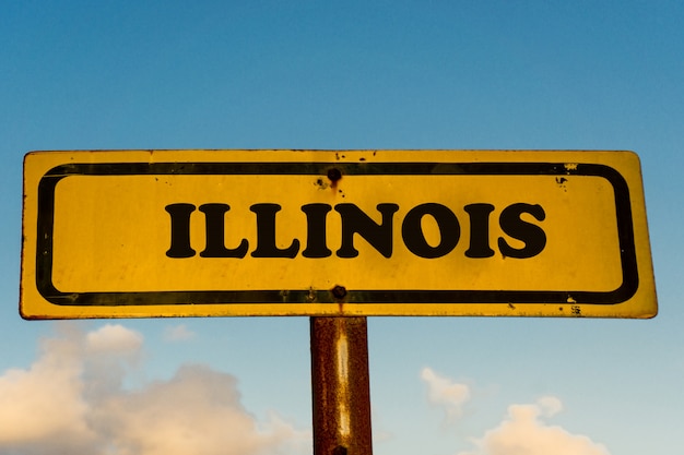 Foto illinois zustand auf altem gelbem schild mit blauem himmel