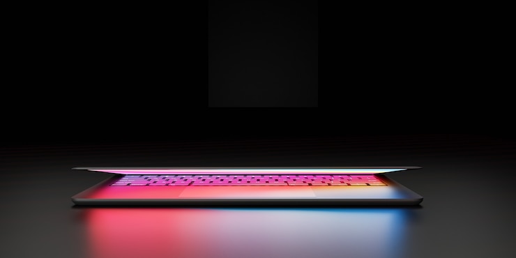 Foto ilustração de renderização 3d. o computador portátil com tela colorida e teclado fecha a tampa do lugar na câmara escura e o efeito de iluminação. imagem para apresentação.