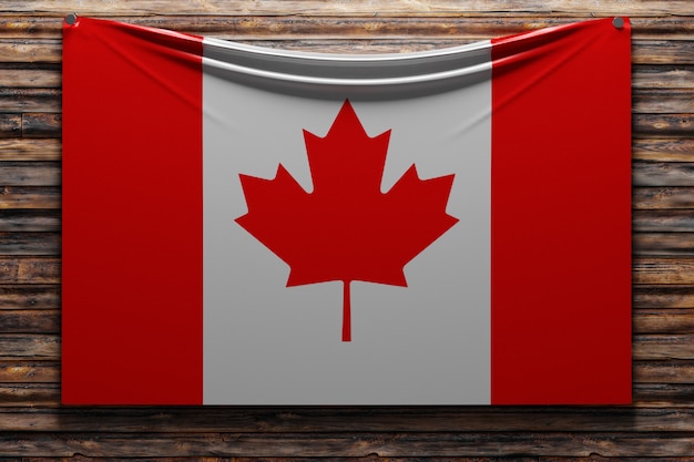 Ilustración de la bandera nacional de tela de Canadá clavada en una pared de madera