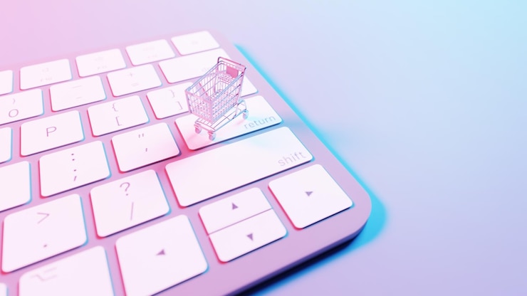Foto esta ilustración representa un carrito de compras colocado encima de un fondo de teclado que fusiona los conceptos de compras en línea y tecnología digital