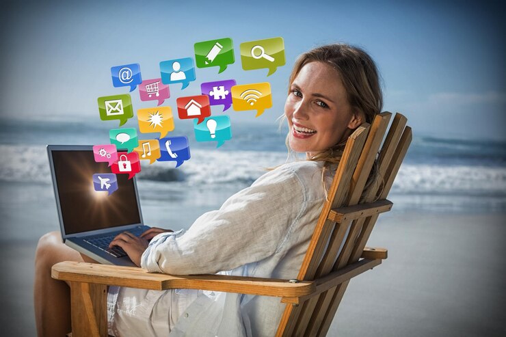 Foto imagem composta de linda loira sentada na espreguiçadeira usando laptop na praia 3d