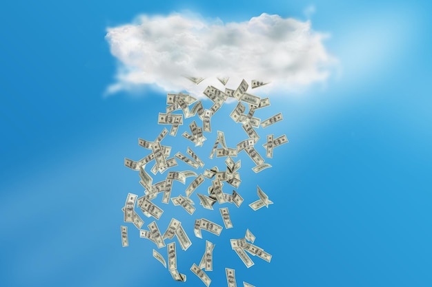 Imagem composta de nuvem com chuva de dinheiro com céu azul brilhante no fundo