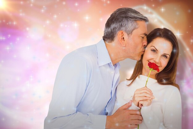 Imagem composta de retrato de esposa segurando rosa com marido