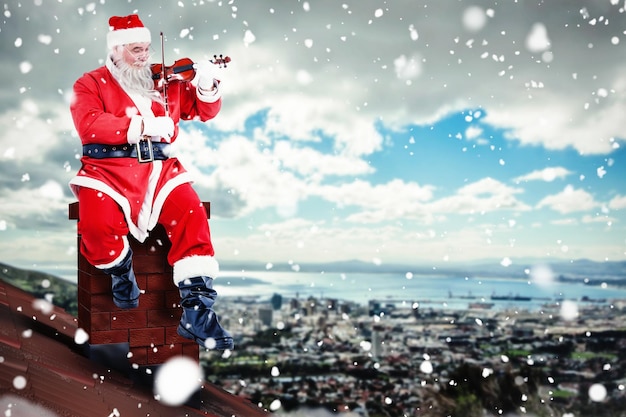 Imagem composta de sorridente Papai Noel tocando violino na cadeira