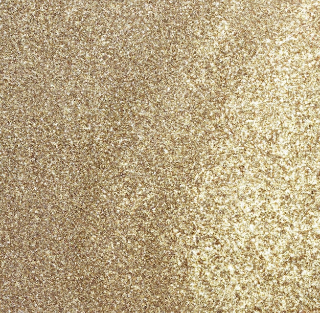 Imagem de close-up de fundo de partículas de glitter dourados com espaço de cópia