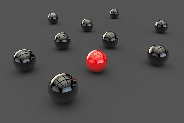 Imagen 3D de una bola roja entre muchas bolas negras en una superficie gris