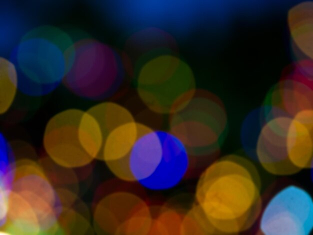 Imagen borrosa abstracta de la luz colorida de la fiesta nocturna bokeh sobre fondo oscuro Fondo de bokeh festivo y celebración borrosa Luz de festival borrosa