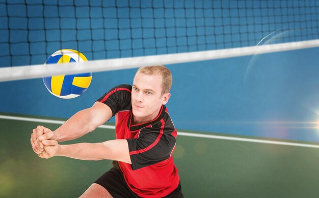 Imagen compuesta de deportista posando mientras juega voleibol