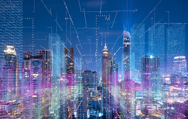 Imagen compuesta digital de edificios iluminados contra el cielo nocturno