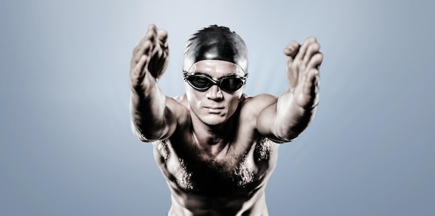 Imagen compuesta de nadador preparándose para bucear