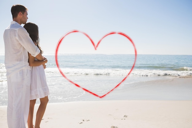 Foto imagen compuesta de pareja atractiva mirando al mar