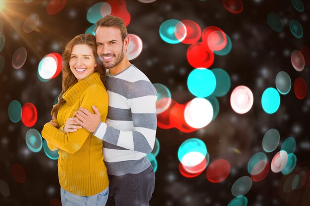 Imagen compuesta de retrato de feliz pareja joven abrazando