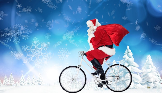 Imagen compuesta de santa claus entregando regalos con bicicleta