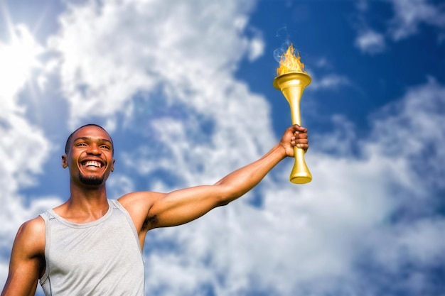 Imagen compuesta de vista frontal del deportista feliz sosteniendo una taza