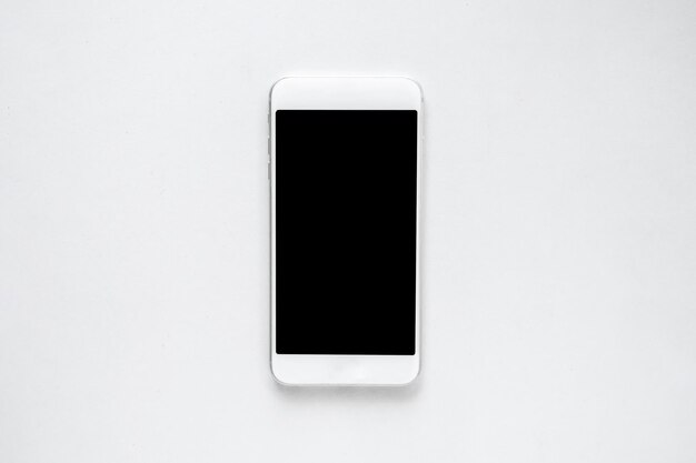 Foto imagen directamente por encima de un teléfono móvil sobre un fondo blanco