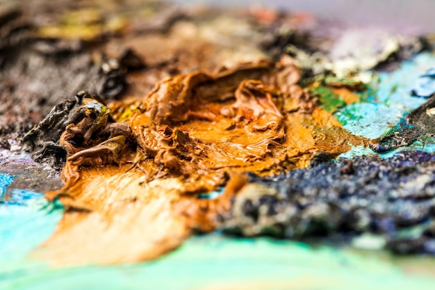 Foto imagen de fondo del primer plano de la paleta de pintura al óleo brillante