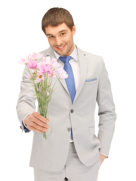 imagen de hombre guapo con flores en la mano