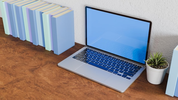 Imagen horizontal de libros azules y olla blanca con planta verde cerca de la computadora portátil trabajo en el tema del hogar