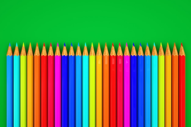 Imagen de lápices de colores. Juego de lápices de colores en fondo verde. De cerca.