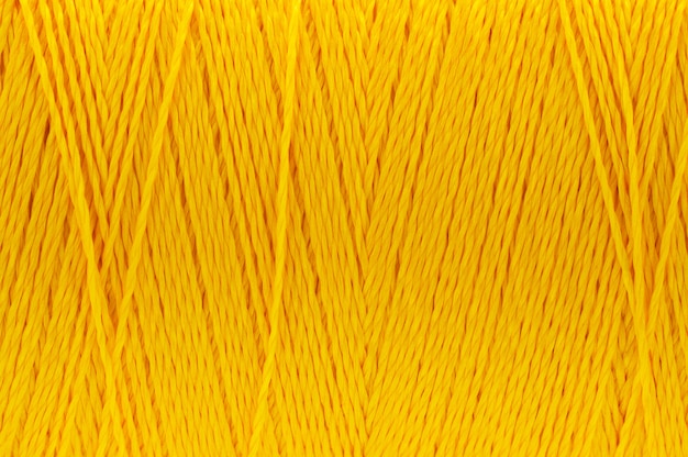 Imagen macro de fondo de color amarillo oscuro de textura de hilo