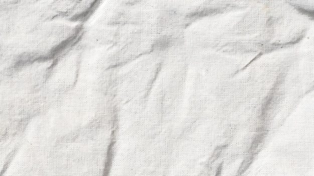 Esta imagen presenta una tela blanca con textura arrugada que sugiere una estética natural y orgánica adecuada para varios proyectos creativos