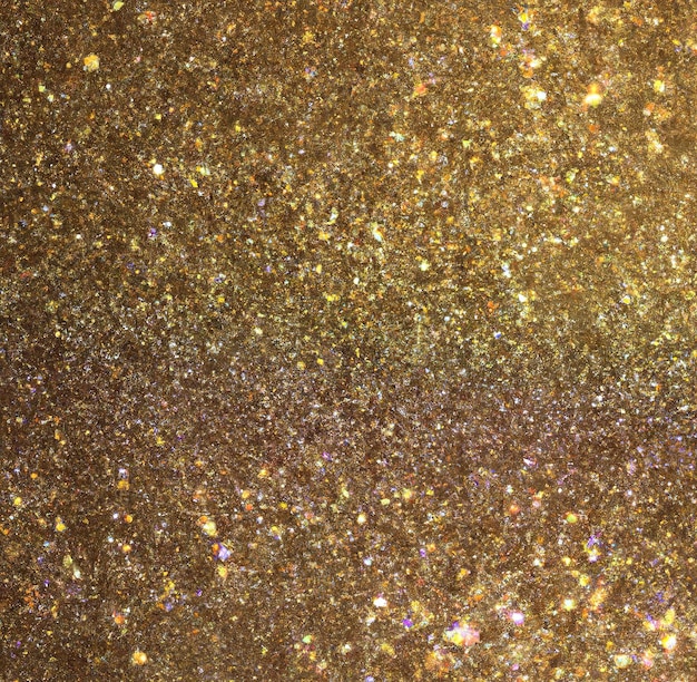 Imagen de primer plano de fondo de partículas de brillo dorado con espacio de copia
