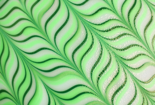 Impresionante patrón ondulado verde degradado de un donut decorativo para un telón de fondo abstracto