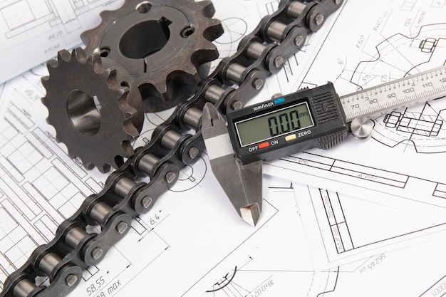 Impulsar la cadena de rodillos industriales, la pinza digital y la rueda dentada en un dibujo de ingeniería de impresión