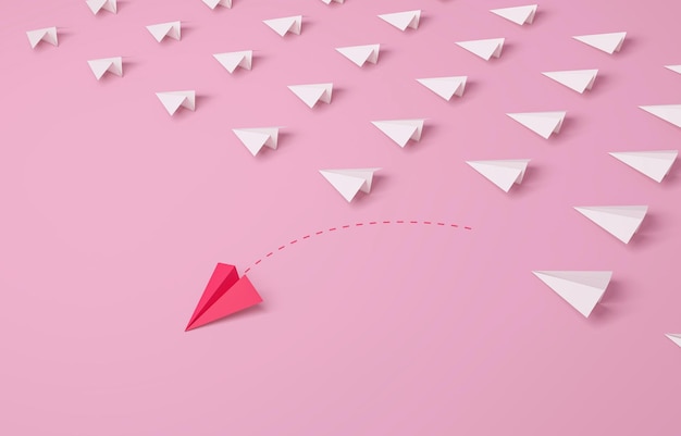 Individualidade Conceito de liderança da mulher 39s Líder individual e único avião de papel rosa mudando de direção