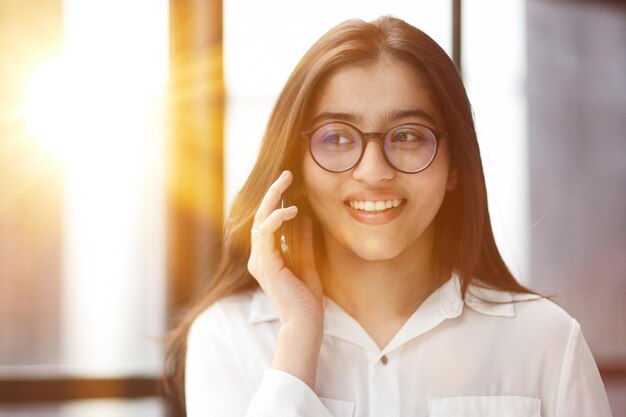 Informal Call Young woman in glasses calling her friend talking and asking about something