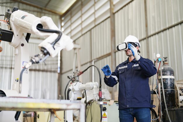 Foto ingenieros industriales multirraciales que trabajan en una fábrica automatizada de producción robótica de ia nuevo concepto de tecnología industrial