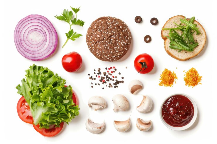 Ingredientes frescos para hacer una hamburguesa gourmet, incluida lechuga, tomate, queso, cebolla y carne curada
