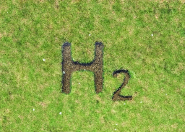 Inscrição H2 no prado verde