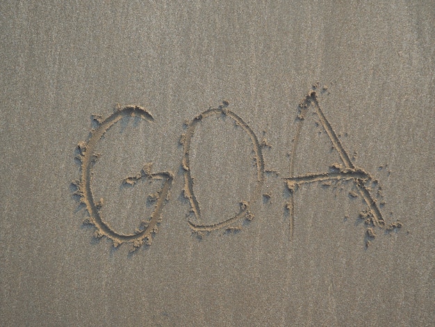 Inscrição na areia - Goa, close-up ao pôr do sol