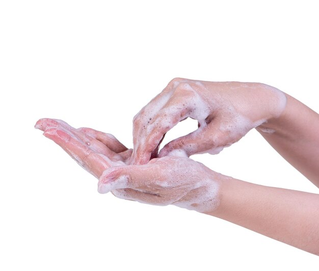 Foto instrução de lavagem manual isolada em fundo branco jovem asiática usando o conceito de sabão líquido para proteger o coronavírus pandêmico de perto