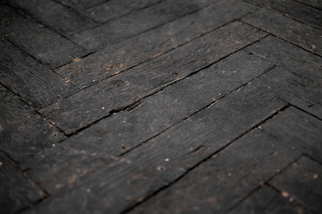 interessante padrão de parquet preto listrado montado em uma textura de ângulo para o seu design de piso
