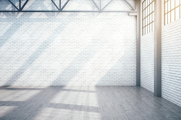 Interior de almacén minimalista con ventana y pared de ladrillo en blanco