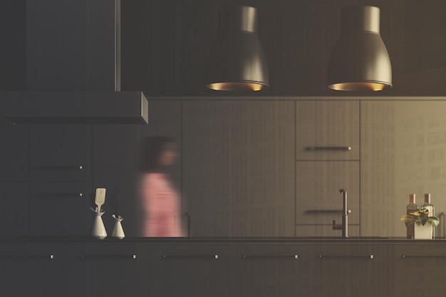 Interior da cozinha cinza moderna com armários e bancadas cinza e duas luminárias de teto originais. Um close. Uma mulher renderização 3d simula uma imagem tonificada com dupla exposição desfocada