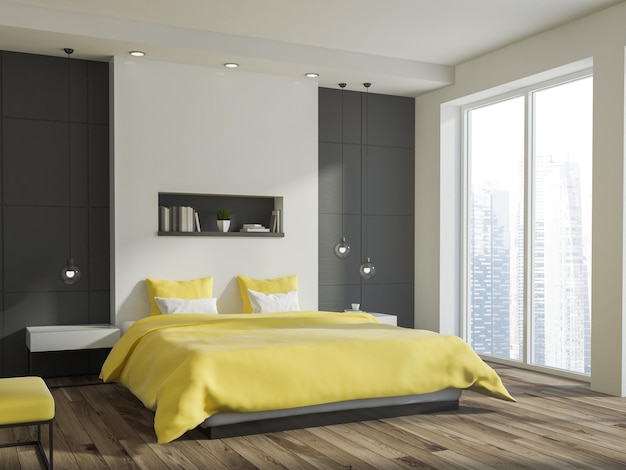 Interior de dormitorio de pared blanca y gris con una cama amarilla, un estante por encima, un piso de madera y una ventana panorámica.