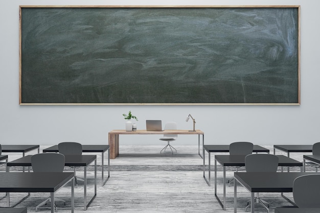 Interior moderno de aula gris con muebles de pizarra y suelo de madera. Lugar simulado. Concepto de regreso a la escuela. Representación 3D.